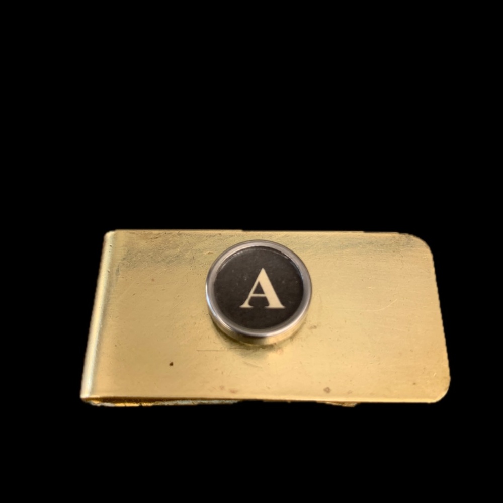 A vintage typewriter key money clip